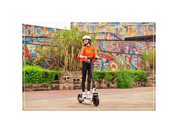 a girl is having fun with yadea ks5 pro electric scooter